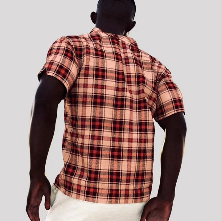 CG3D render — back view of an avatar in a red-and-pink checked short-sleeve shirt