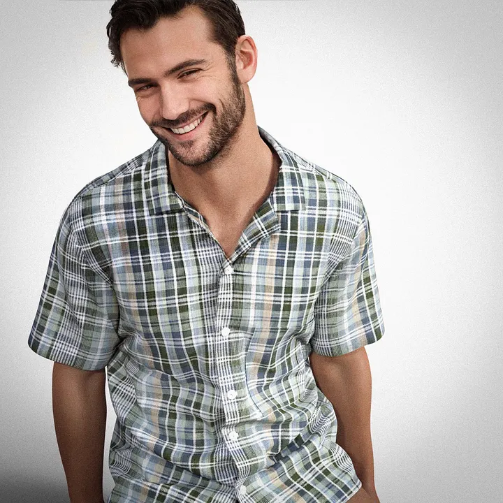CG3D render — smiling avatar in a green, blue and cream checked camp-collar shirt